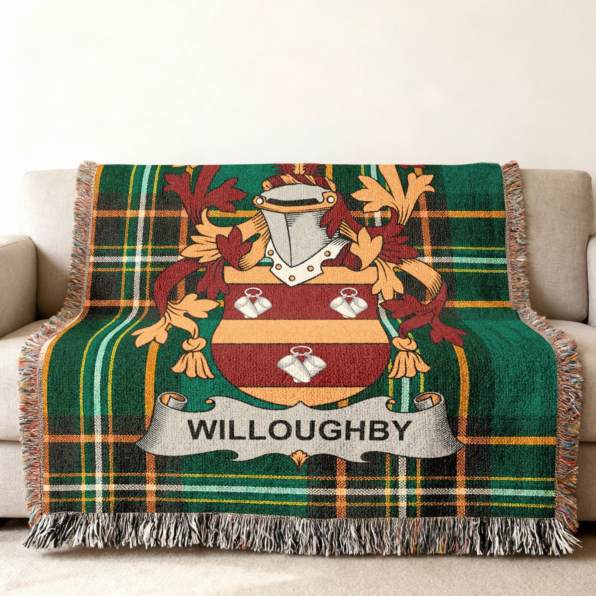 Woven throw blanket with plaid design and Willoughby family crest.