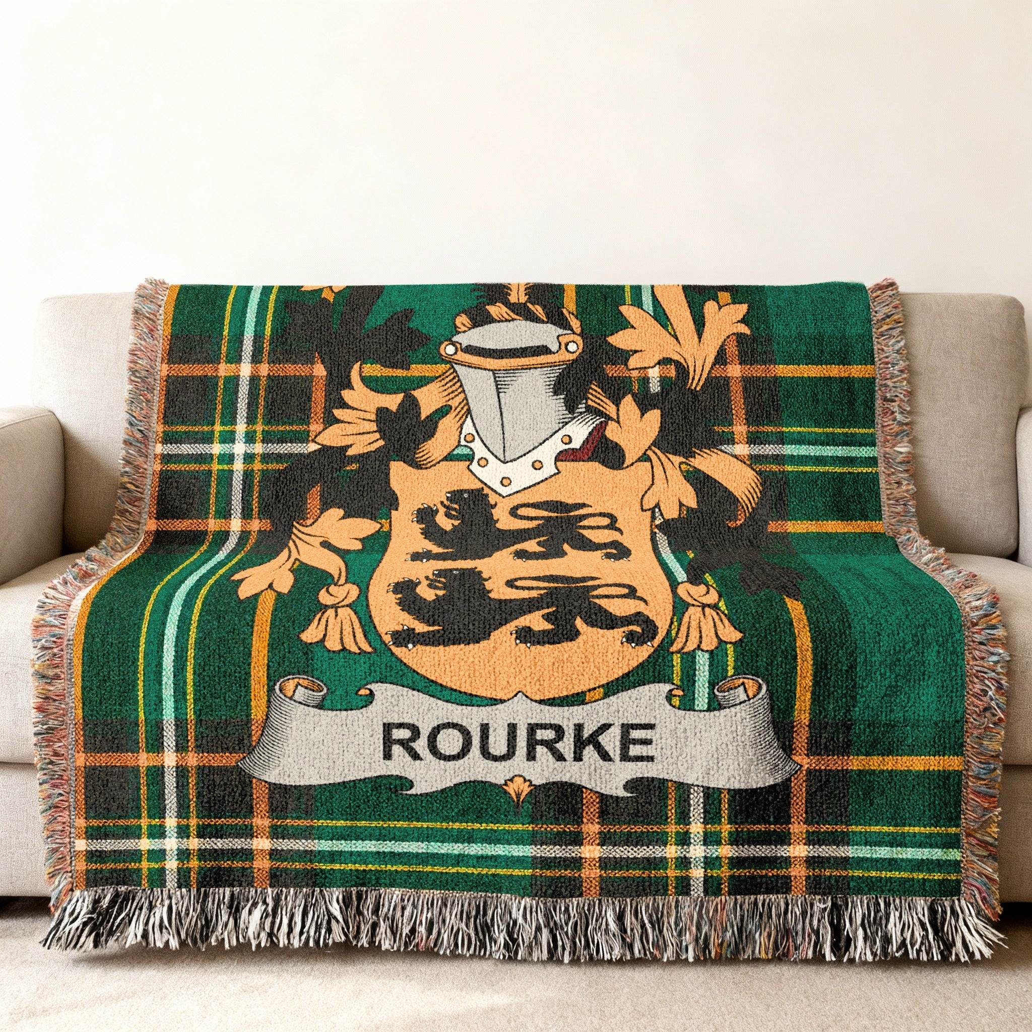 Woven tartan blanket featuring the Rourke family crest in the center.