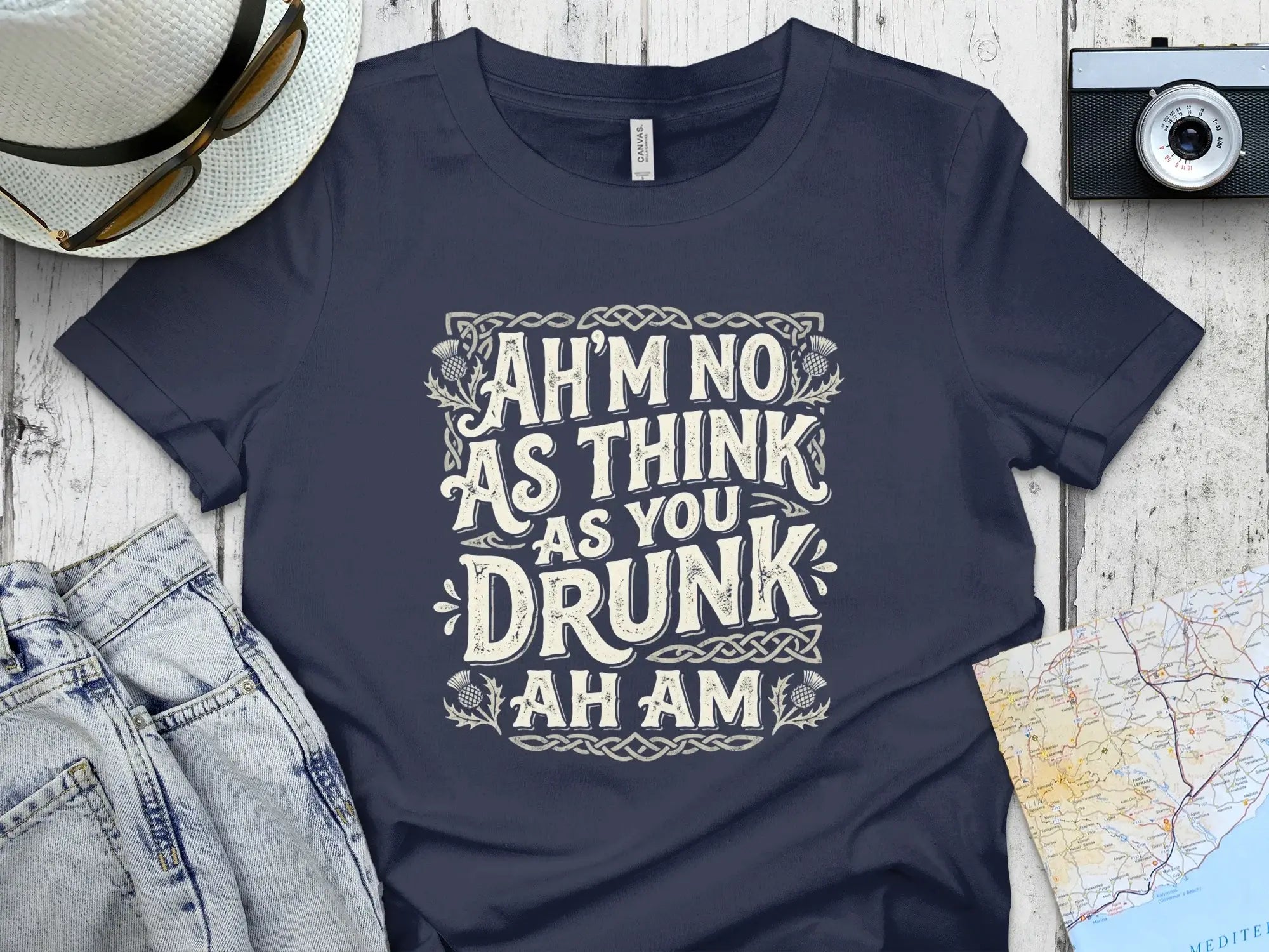 Navy t-shirt with "Ah'm no as think as you drunk ah am" text.