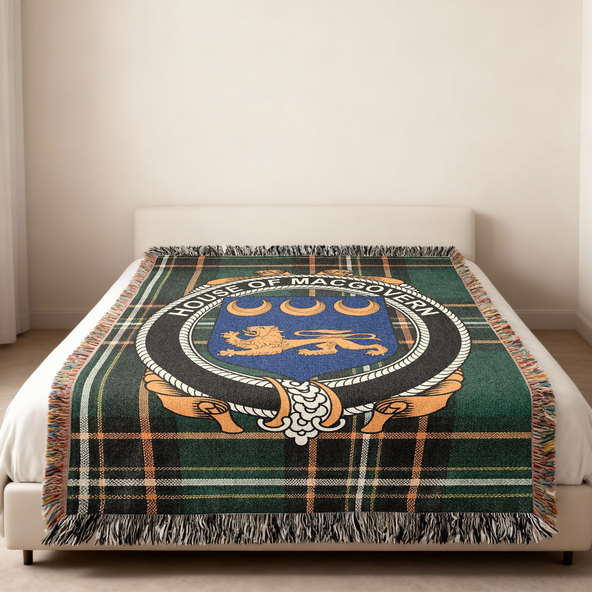 MacGovern family crest emblem woven blanket displayed on a bed