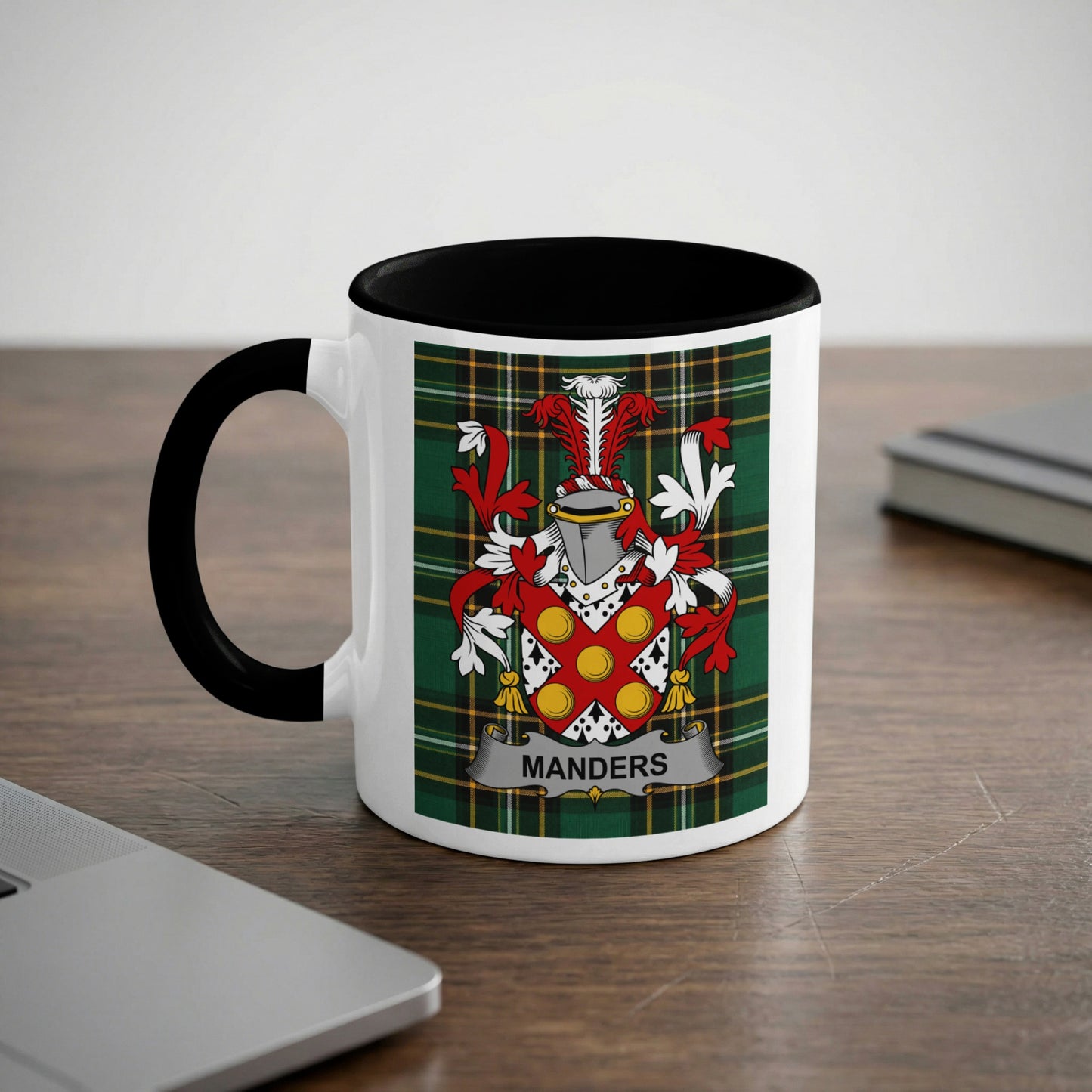 Mug with a coat of arms and the name "MANDERS" on a plaid background.