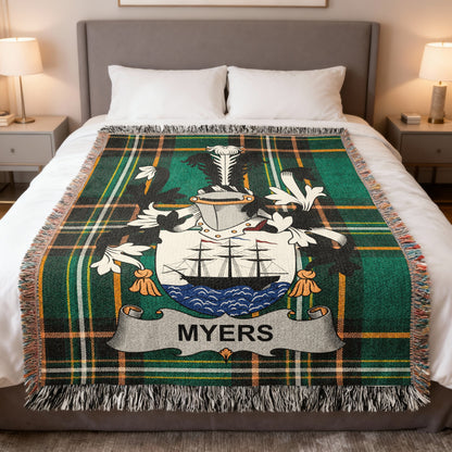 Tartan blanket with Myers family crest featuring a ship and shield.