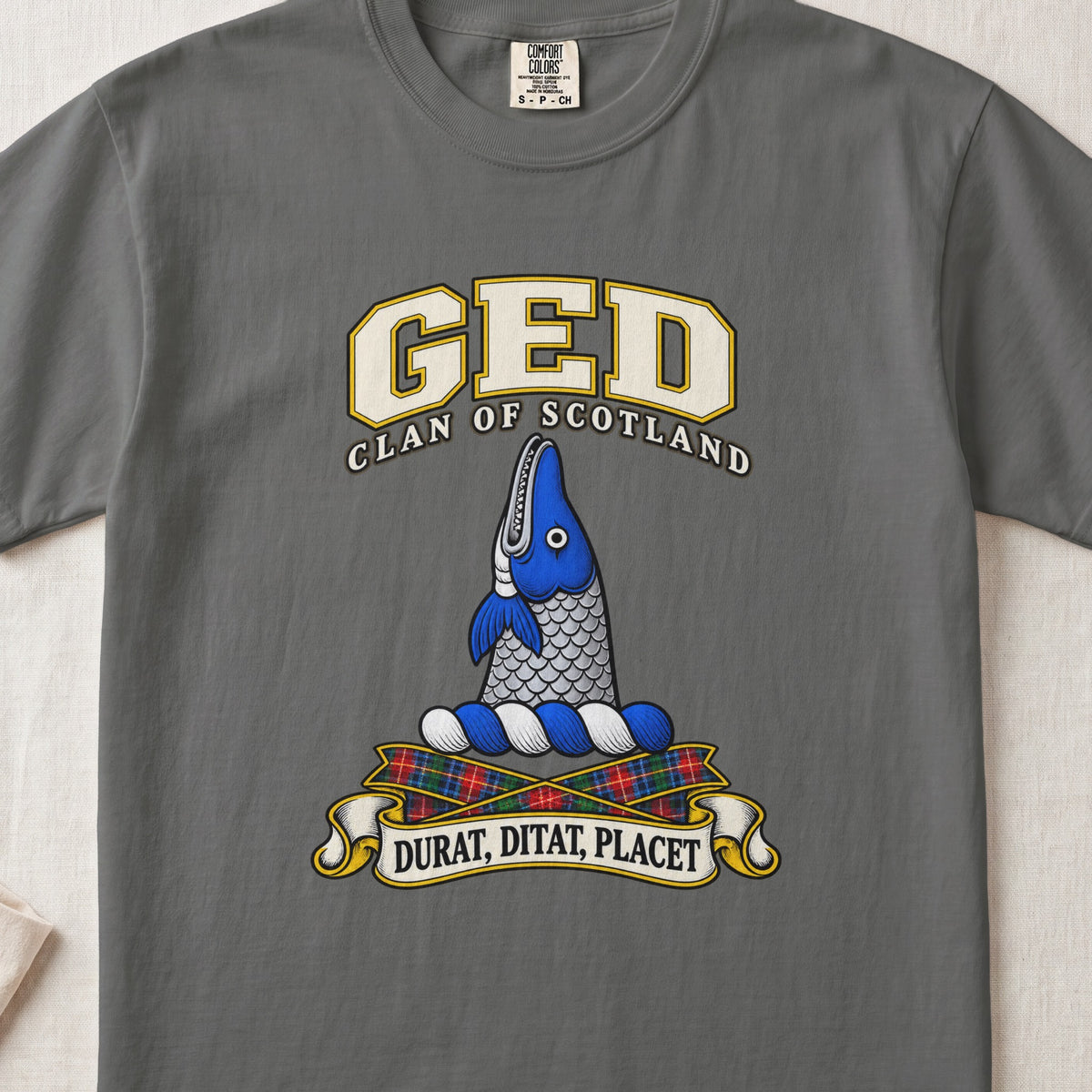 Ged Scottish clan T-shirt in Pepper, front view with an upright blue-and-silver fish and motto banner.