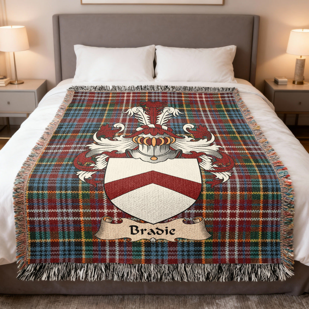 Bradie family crest emblem on a Caledonia tartan woven blanket
