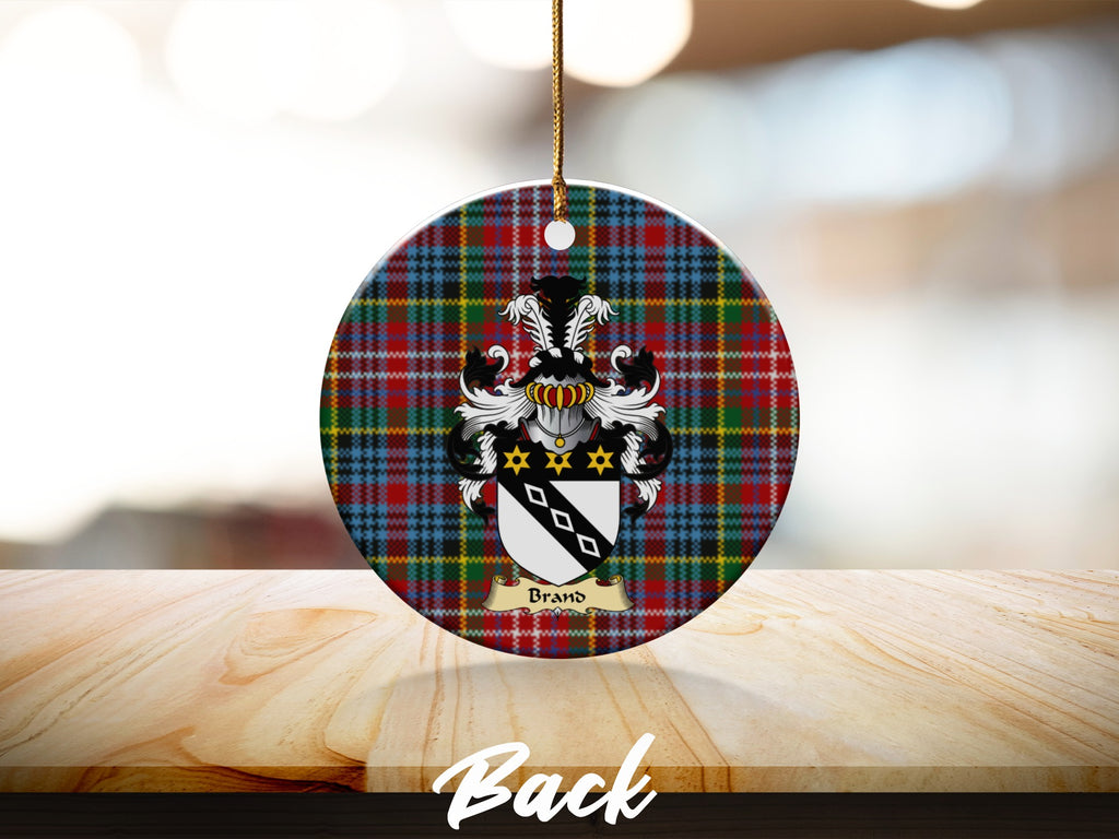Round Brand Scottish clan ornament with family crest on a Caledonia tartan background