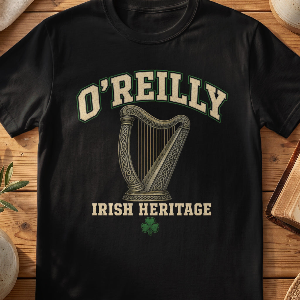 O'Reilly Irish harp T-shirt in Black, with cream surname lettering, a gold-toned harp, green shamrock and “Irish Heritage” text.