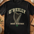 O'Reilly Irish harp T-shirt in Black, with cream surname lettering, a gold-toned harp, green shamrock and “Irish Heritage” text.