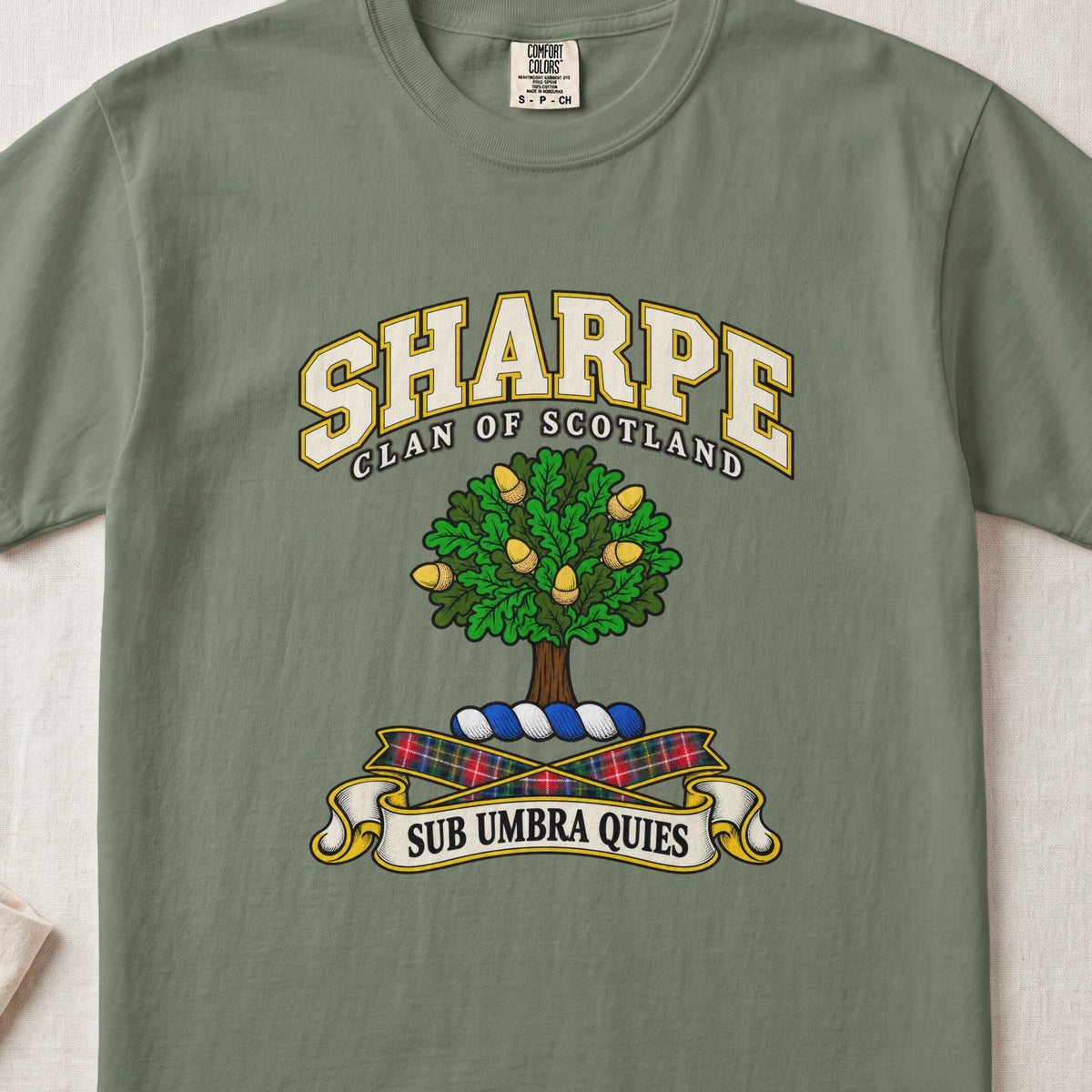 Sharpe Scottish clan T-shirt in Moss, front view with a green tree with golden acorns and motto design.