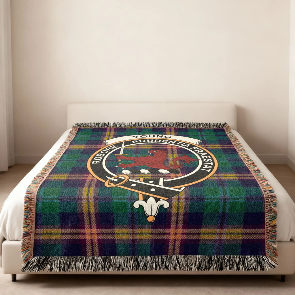 Young tartan woven cotton blanket shown in three sizes