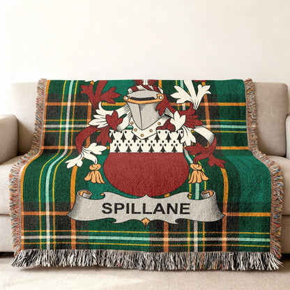 Green tartan throw blanket with Spillane family crest in the center.