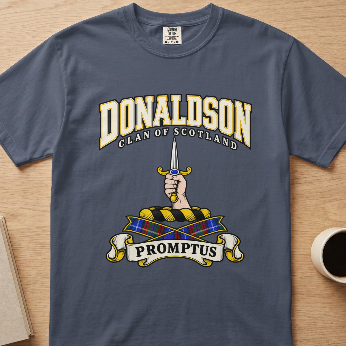 Donaldson upright sword and gripping hand graphic on a slate blue Comfort Colors T-shirt, front view
