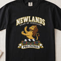 Newlands Scottish clan T-shirt in Black, front view with a golden lion standing upright and motto design.