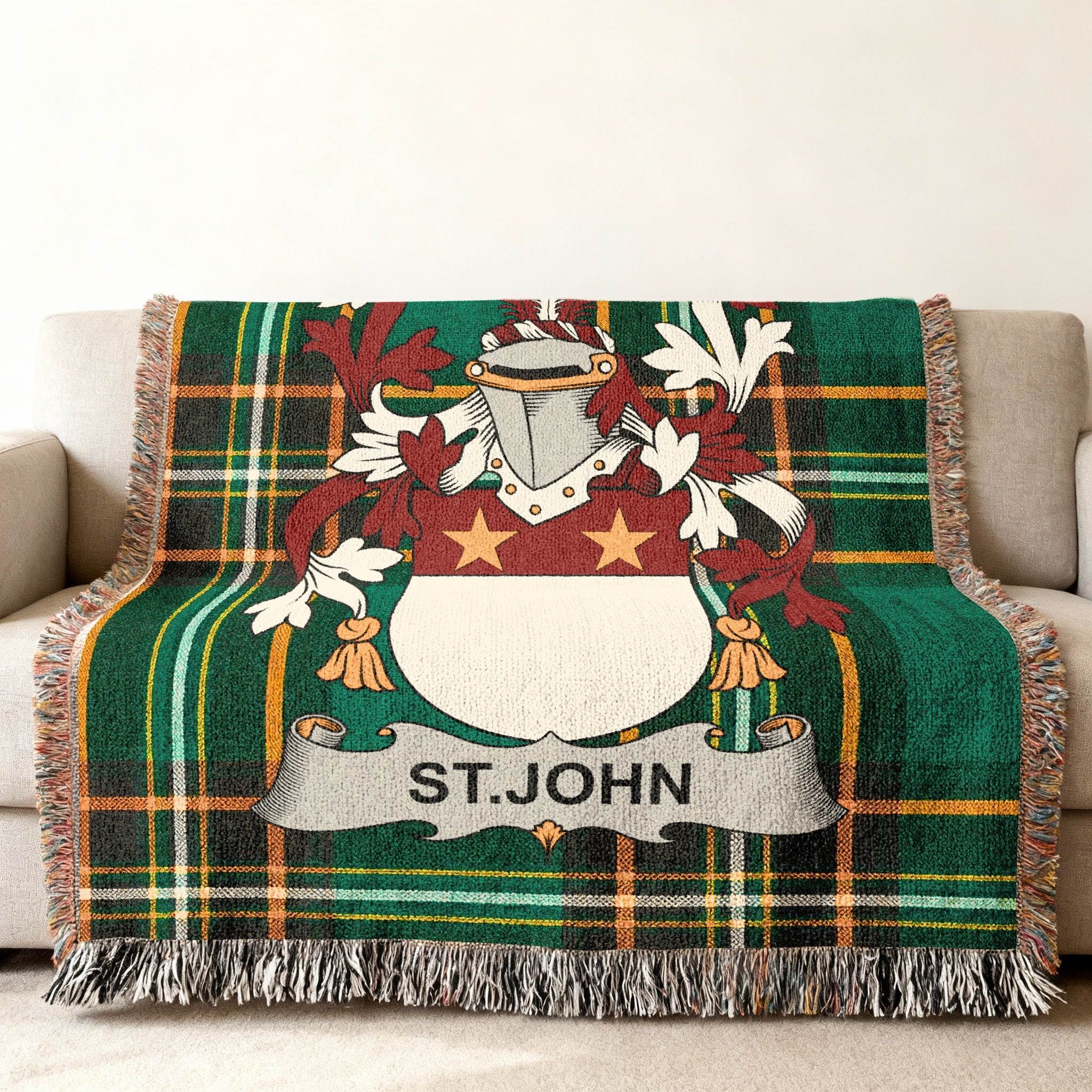 Green plaid throw blanket with St. John crest and fringe.