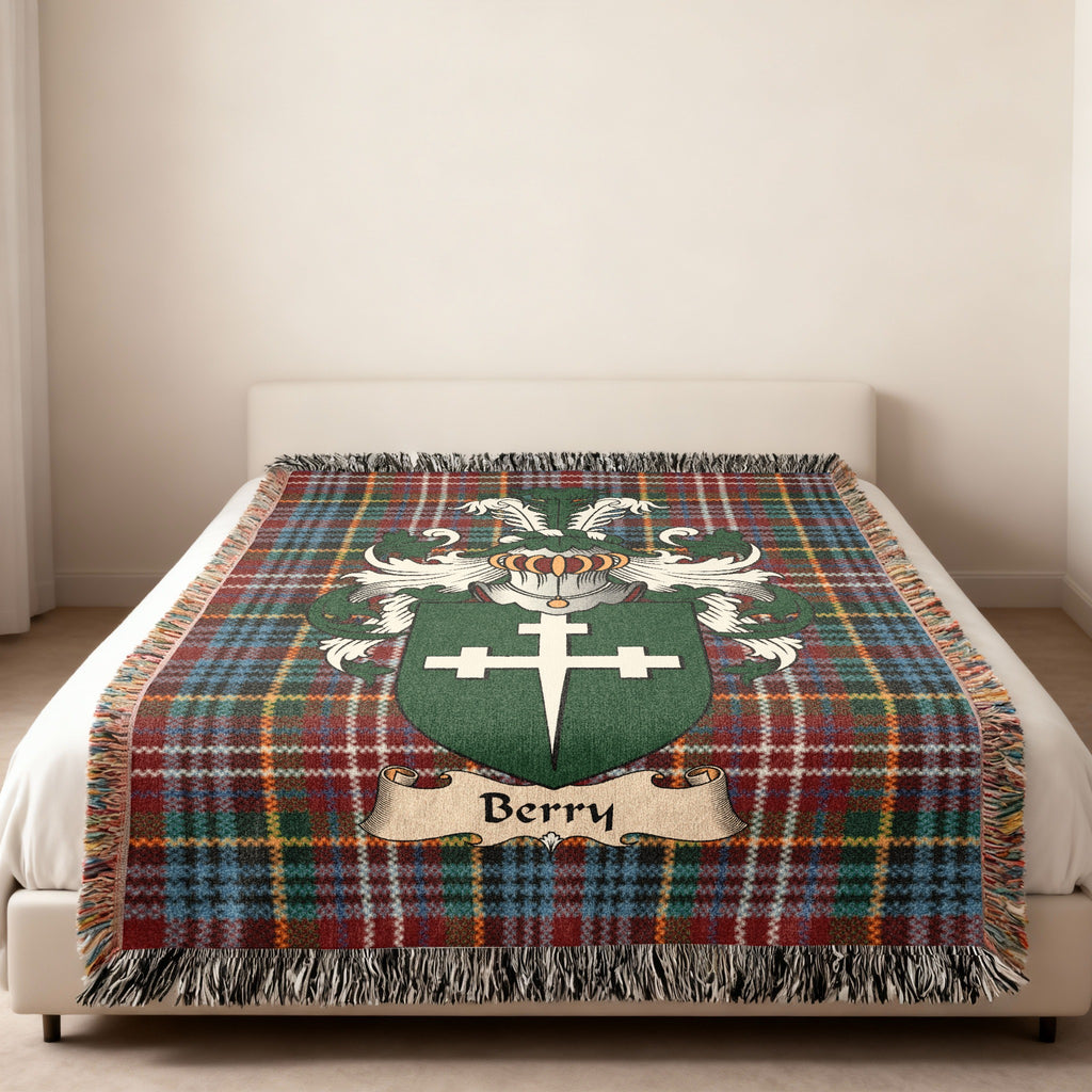 Berry family crest emblem on a Caledonia tartan woven blanket