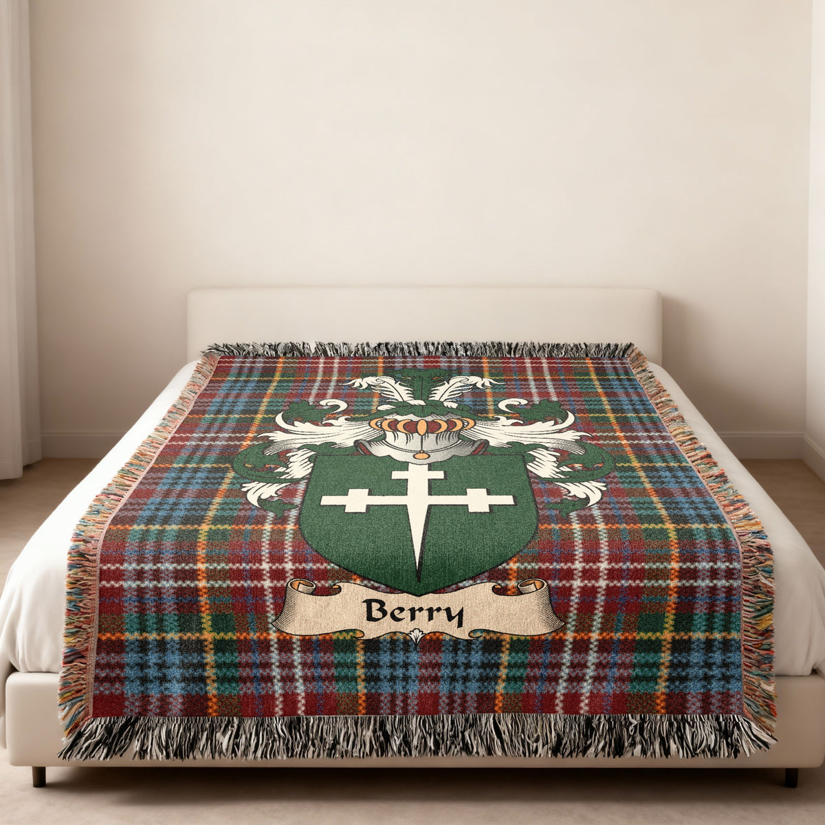 Berry family crest emblem on a Caledonia tartan woven blanket