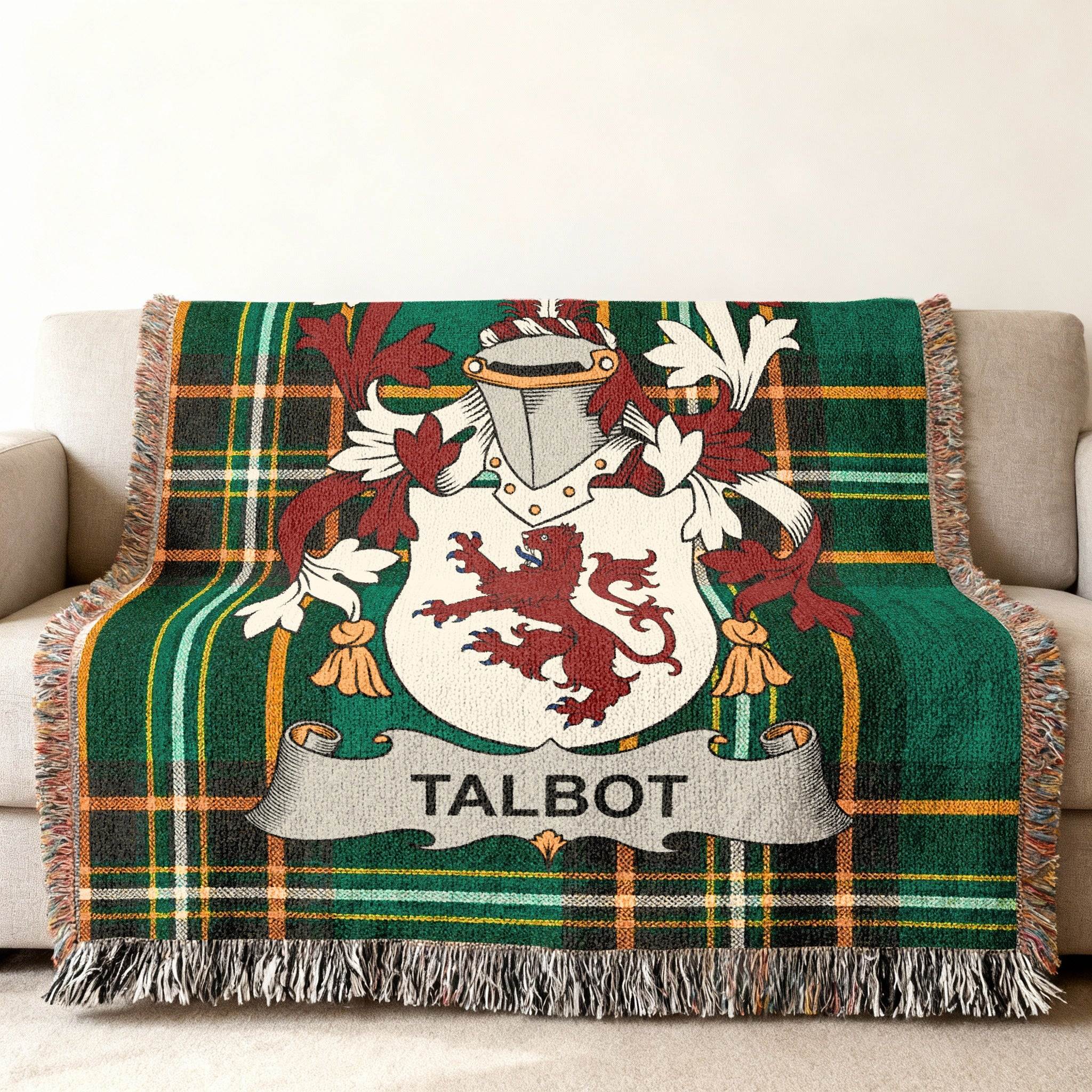 Talbot family crest on green plaid woven throw blanket.
