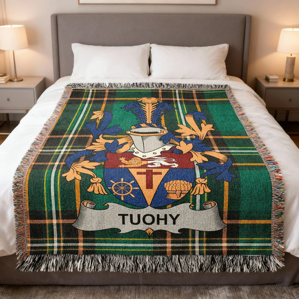Tartan blanket with the TUOHY family crest in the center.