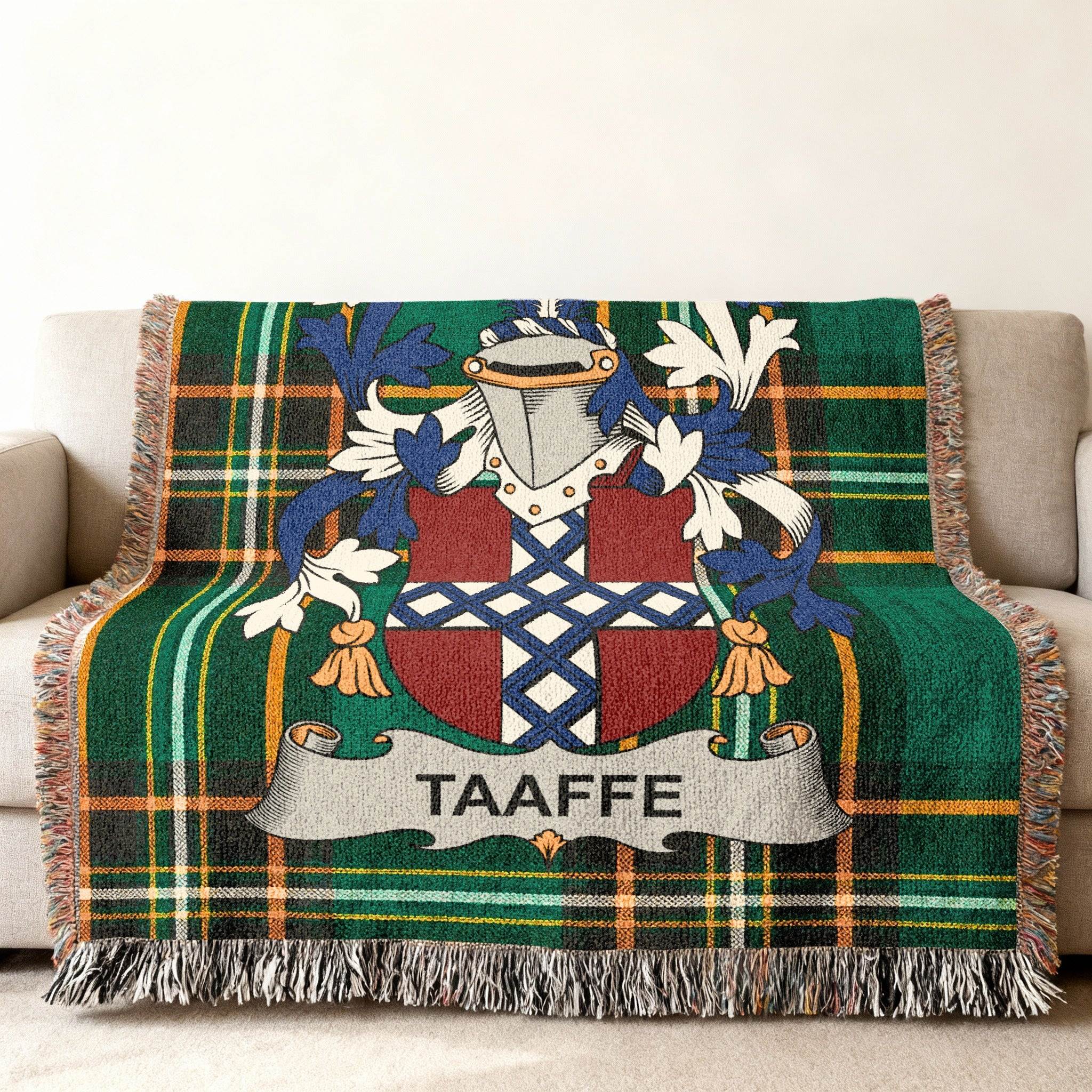 Taafe family crest on a green plaid woven throw blanket.