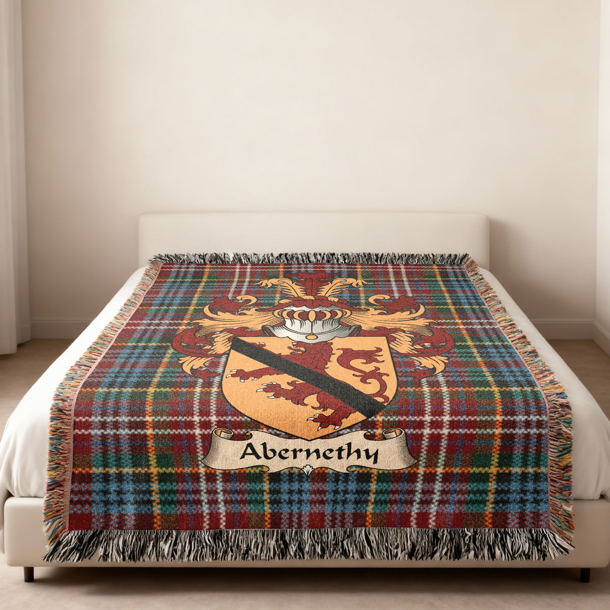 Abernethy family crest emblem on a Caledonia tartan woven blanket