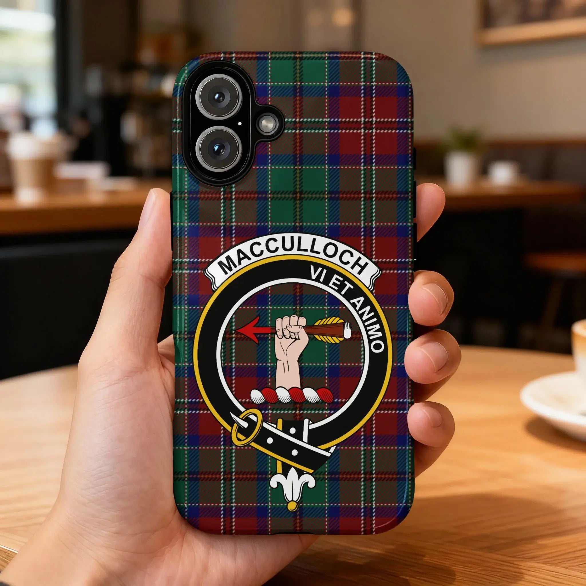 MacCulloch tartan crest case on iPhone — edge-to-edge plaid print with clan crest design