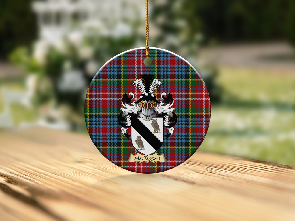 Round MacTaggart Scottish clan ornament with family crest on a Caledonia tartan background