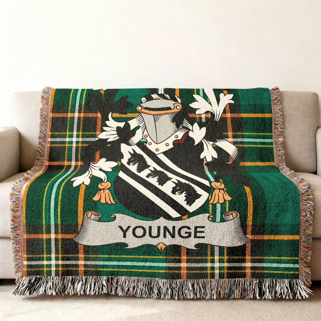 Green tartan blanket with the Younge family crest draped over a couch.