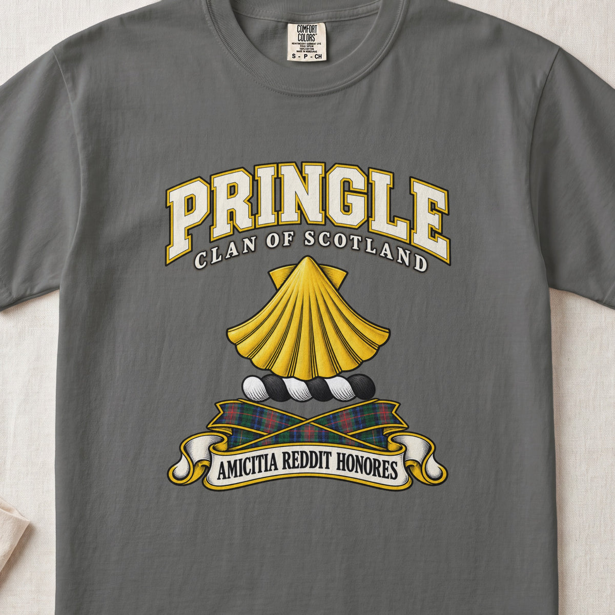 Pringle Scottish clan T-shirt in Pepper, front view with a golden scallop shell and motto design.
