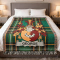 Tartan blanket with a coat of arms and the name GEORGE.