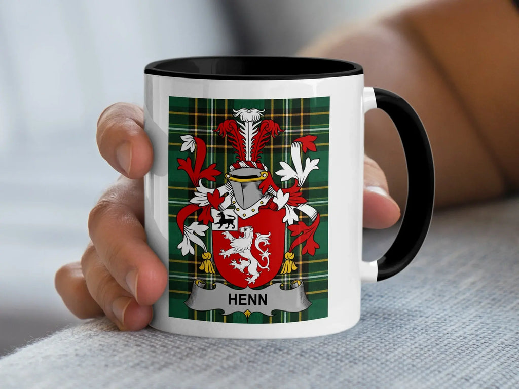 White mug with black rim featuring a coat of arms with "HENN" text.