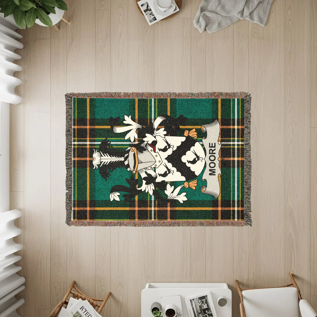 Green tartan blanket with Moore family crest and name.