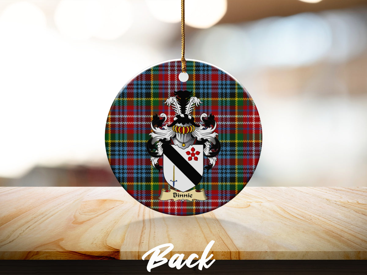 Round Binnie Scottish clan ornament with family crest on a Caledonia tartan background