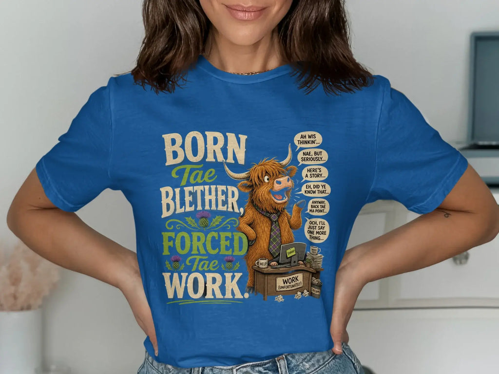 Blue t-shirt with a cartoon Highland cow saying "Born Tae Blether, Forced Tae Work."