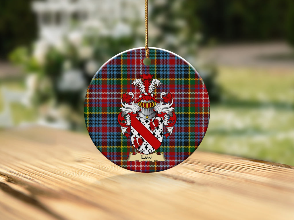 Round Law Scottish clan ornament with family crest on a Caledonia tartan background