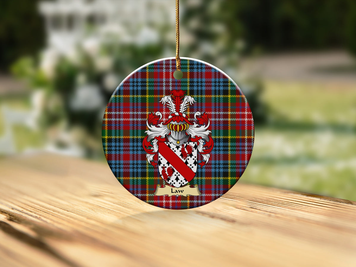 Round Law Scottish clan ornament with family crest on a Caledonia tartan background