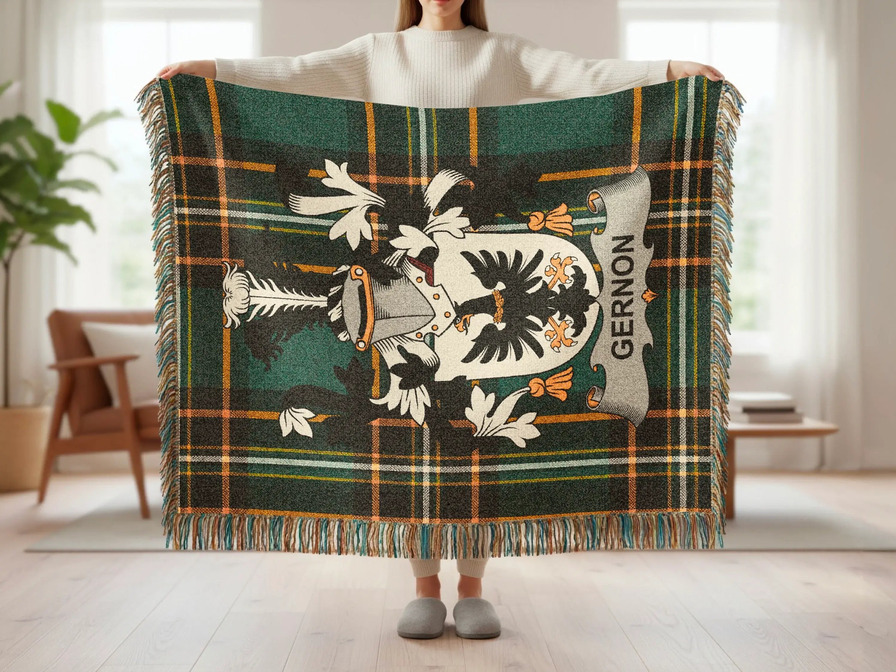 Tartan blanket with a coat of arms and the name "GERNON" displayed.