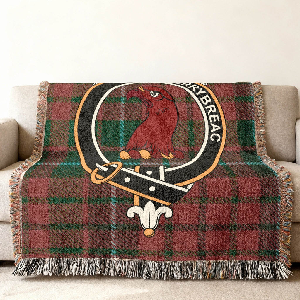 MacNicol tartan woven blanket — close-up of clan crest and bird design in woven cotton yarn