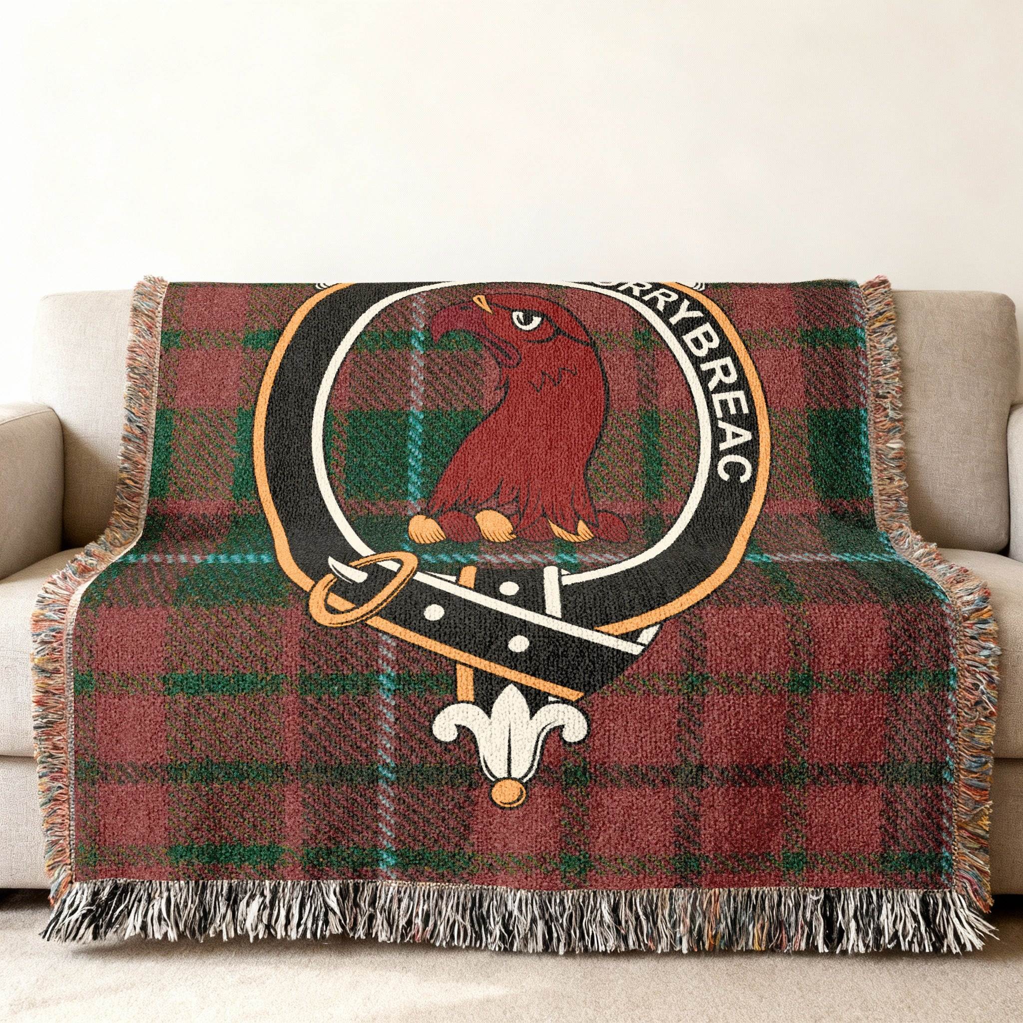 MacNicol tartan woven blanket — close-up of clan crest and bird design in woven cotton yarn