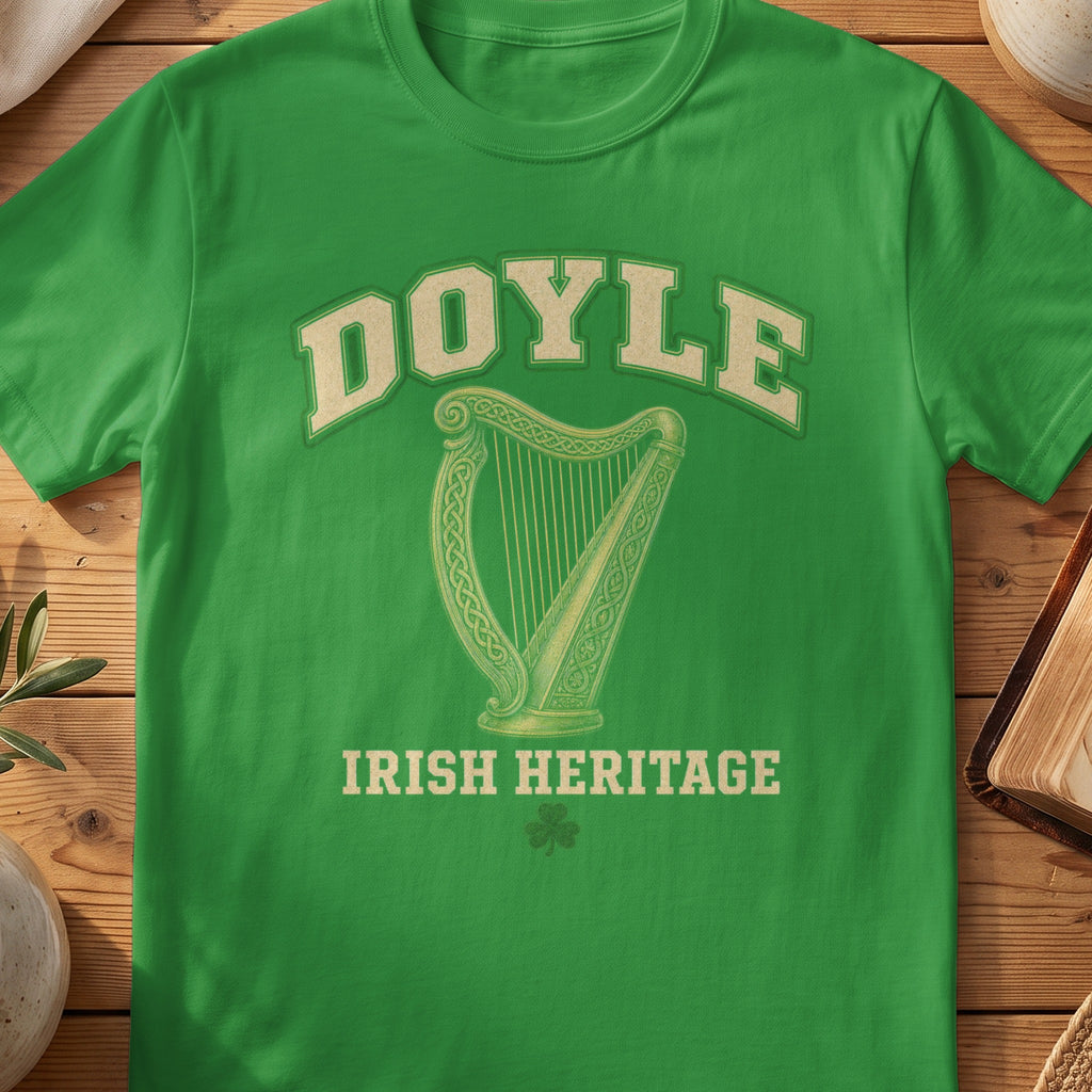 Doyle Irish harp T-shirt in Irish Green, with cream surname lettering, a gold-toned harp, green shamrock and “Irish Heritage” text.
