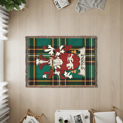 Tapestry featuring a coat of arms with the name "O'TOOLE" on a green tartan background.