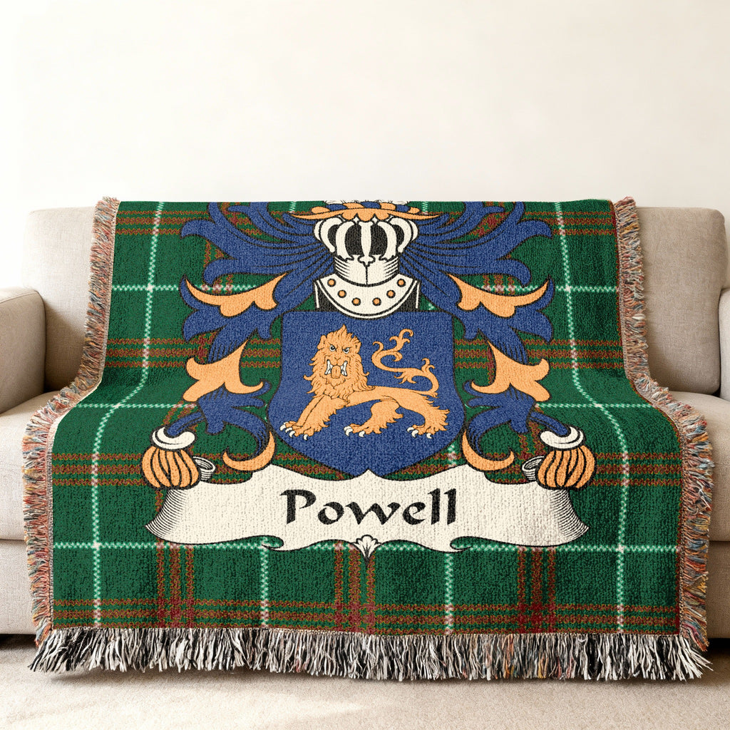 Green plaid blanket with Powell family crest and lion.