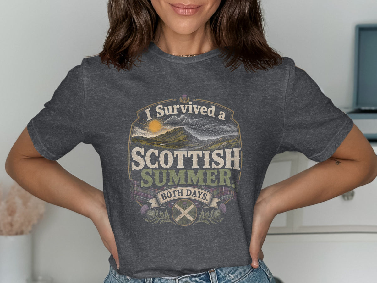 Dark gray t-shirt with "I Survived a Scottish Summer. Both Days." text and Scottish imagery.