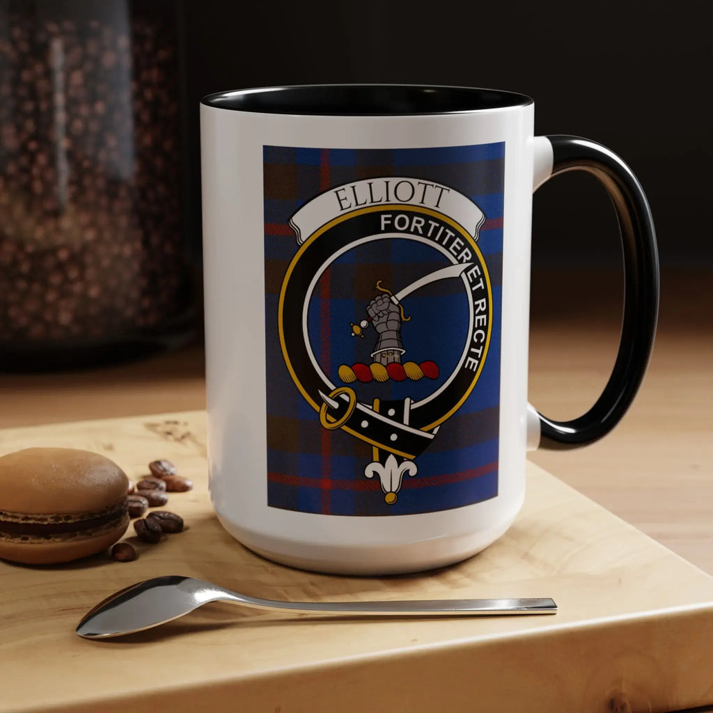 Elliott clan crest white mug with black rim — tartan design with coffee beans beside it