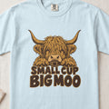 Small Cup, Big Moo Highland cow design on a Chambray Comfort Colors 1717 T-shirt, flat lay