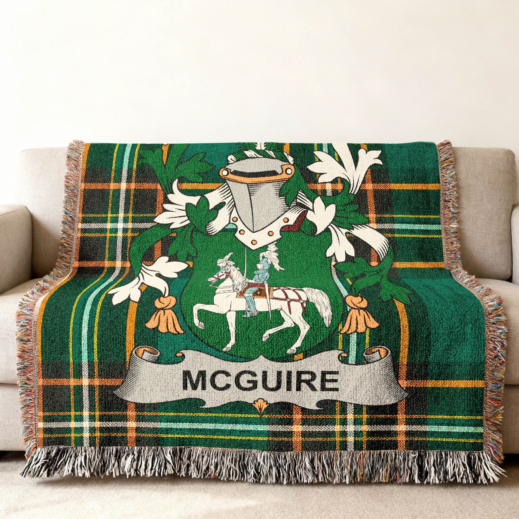 Green tartan blanket with McGuire family crest, featuring a knight on horseback.