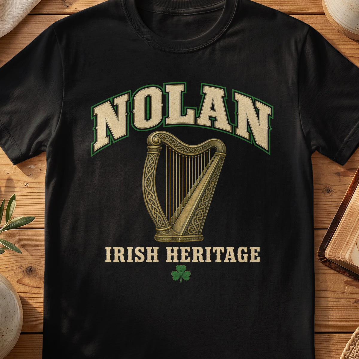 Nolan Irish harp T-shirt in Black, with cream surname lettering, a gold-toned harp, green shamrock and “Irish Heritage” text.