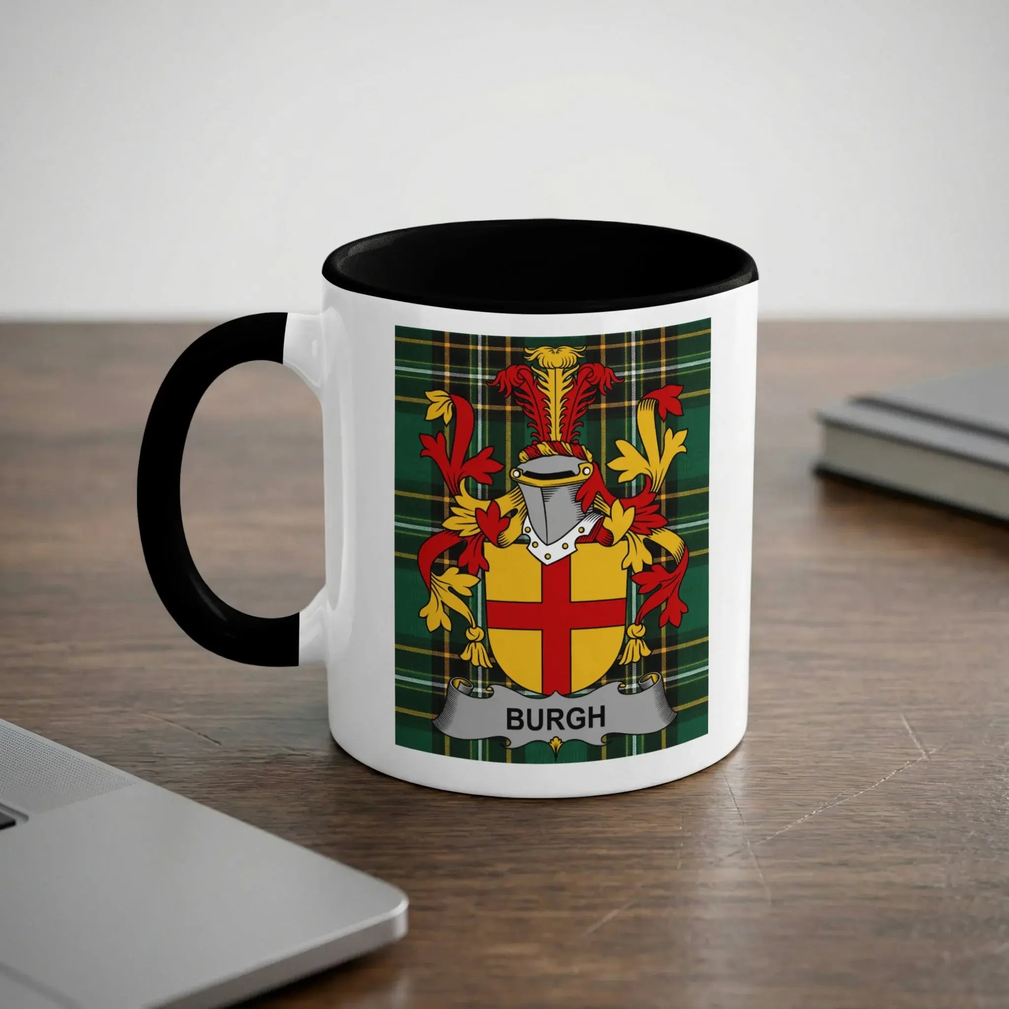 White mug with black rim featuring a family crest with the name "BURGH".