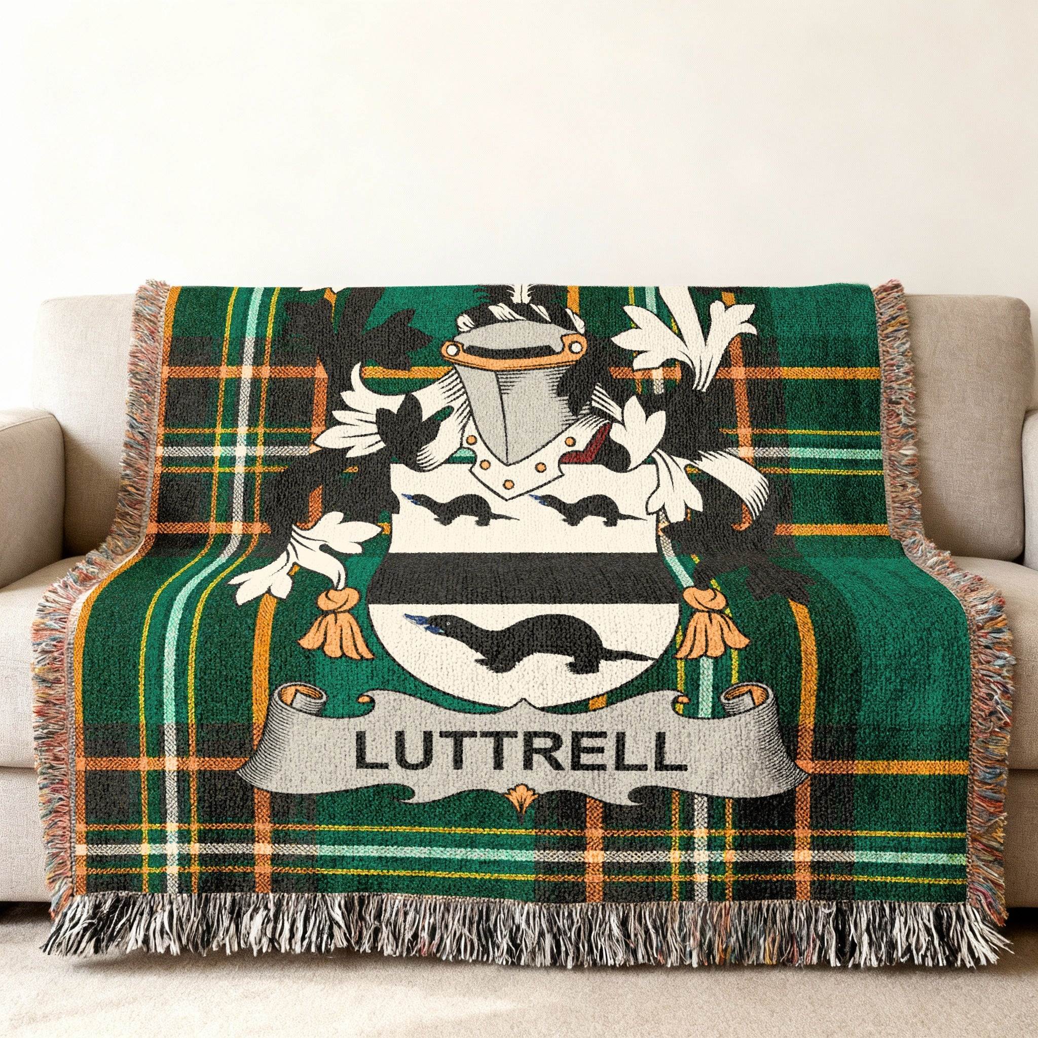 Luttrell family crest on a green and black plaid woven throw blanket.