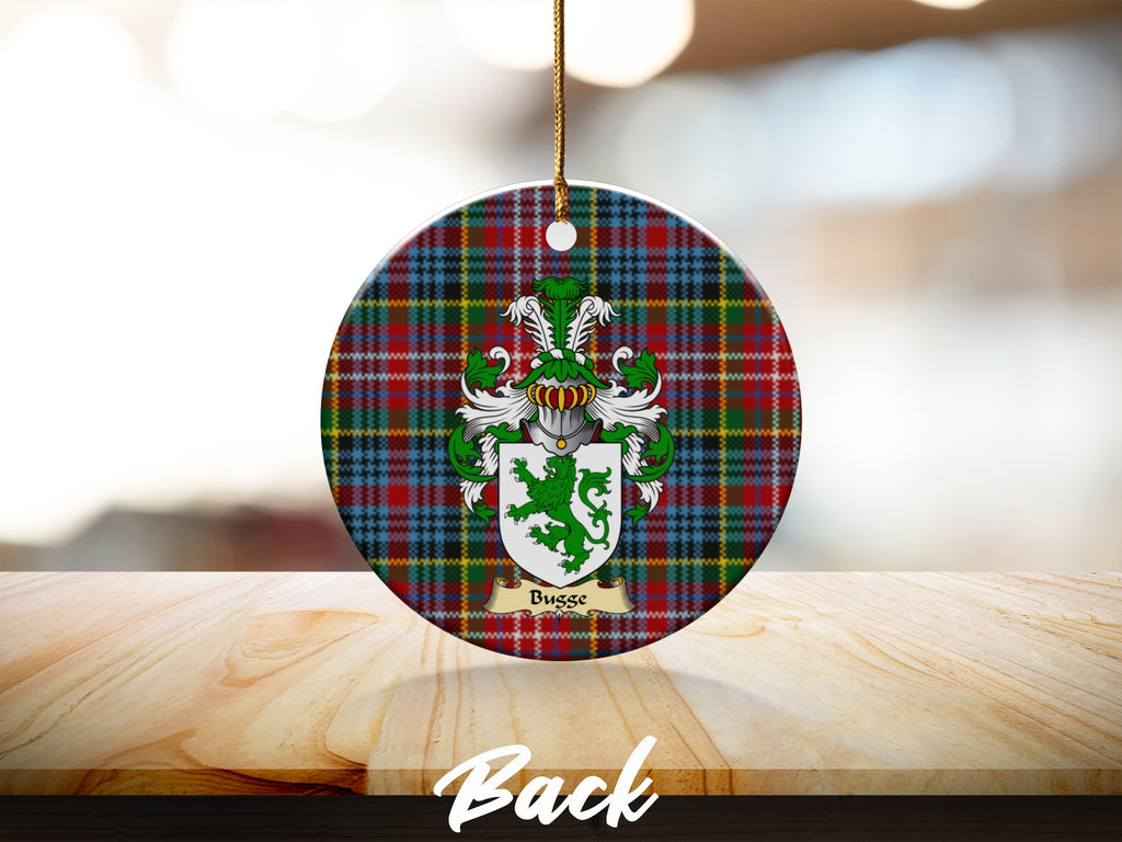 Round Busse Scottish clan ornament with family crest on a Caledonia tartan background