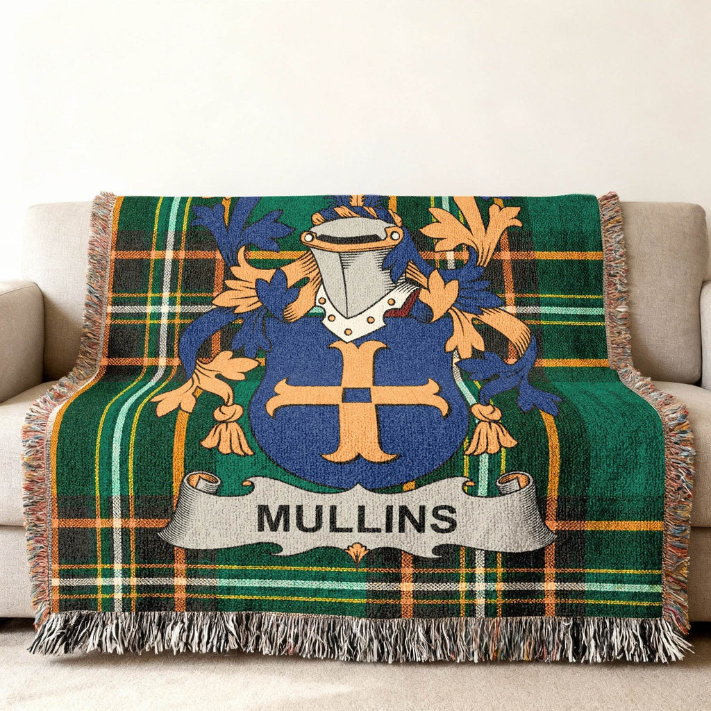 Mullins coat of arms on a green plaid woven blanket with fringe.