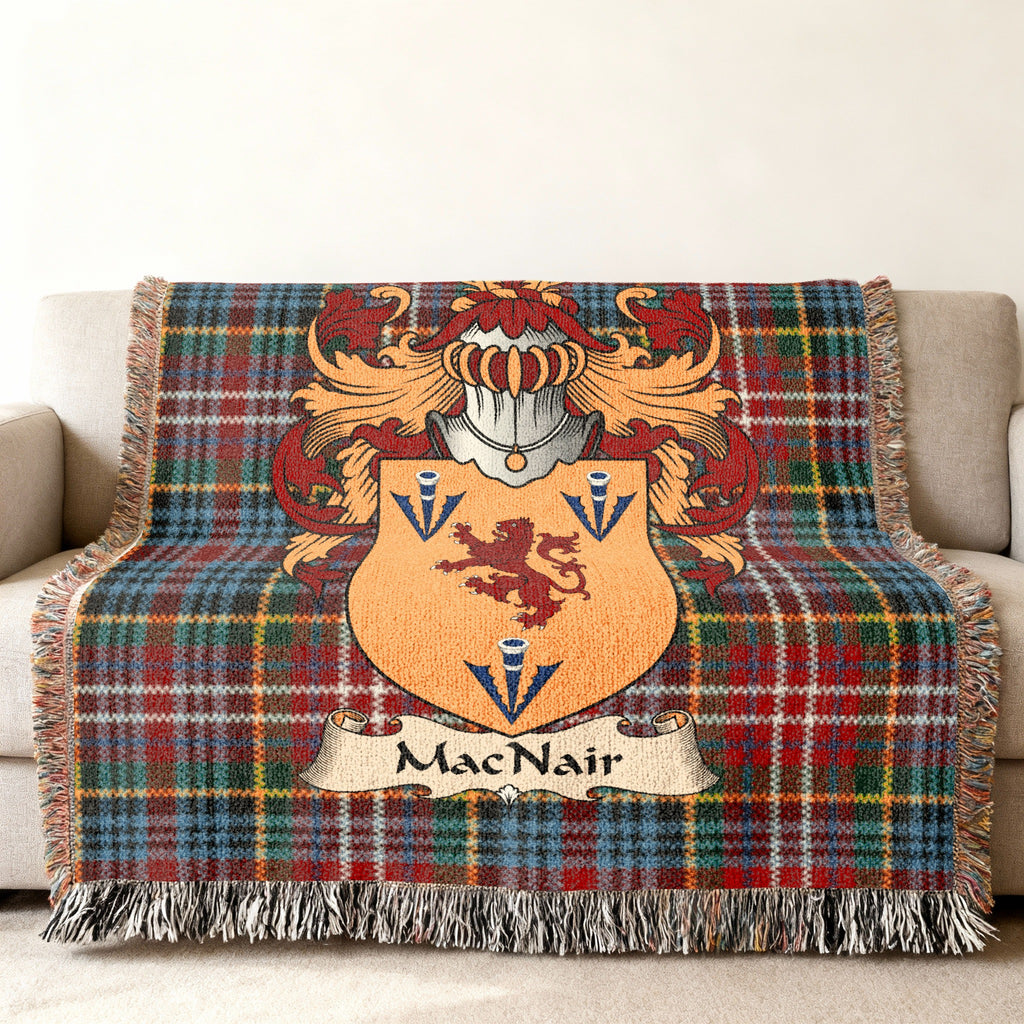 MacNair family crest emblem on a Caledonia tartan woven blanket